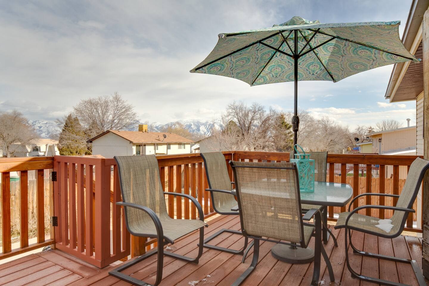 Outdoor dining table and umbrella on the raised deck