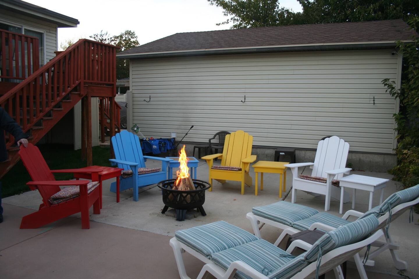 Patio seating arranged around the backyard fire table